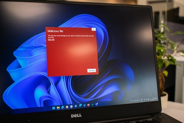 A dell laptop computer with a red screen photo